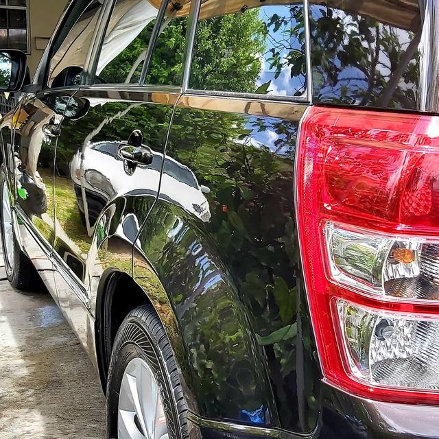 Black SUV with a mirror shine
